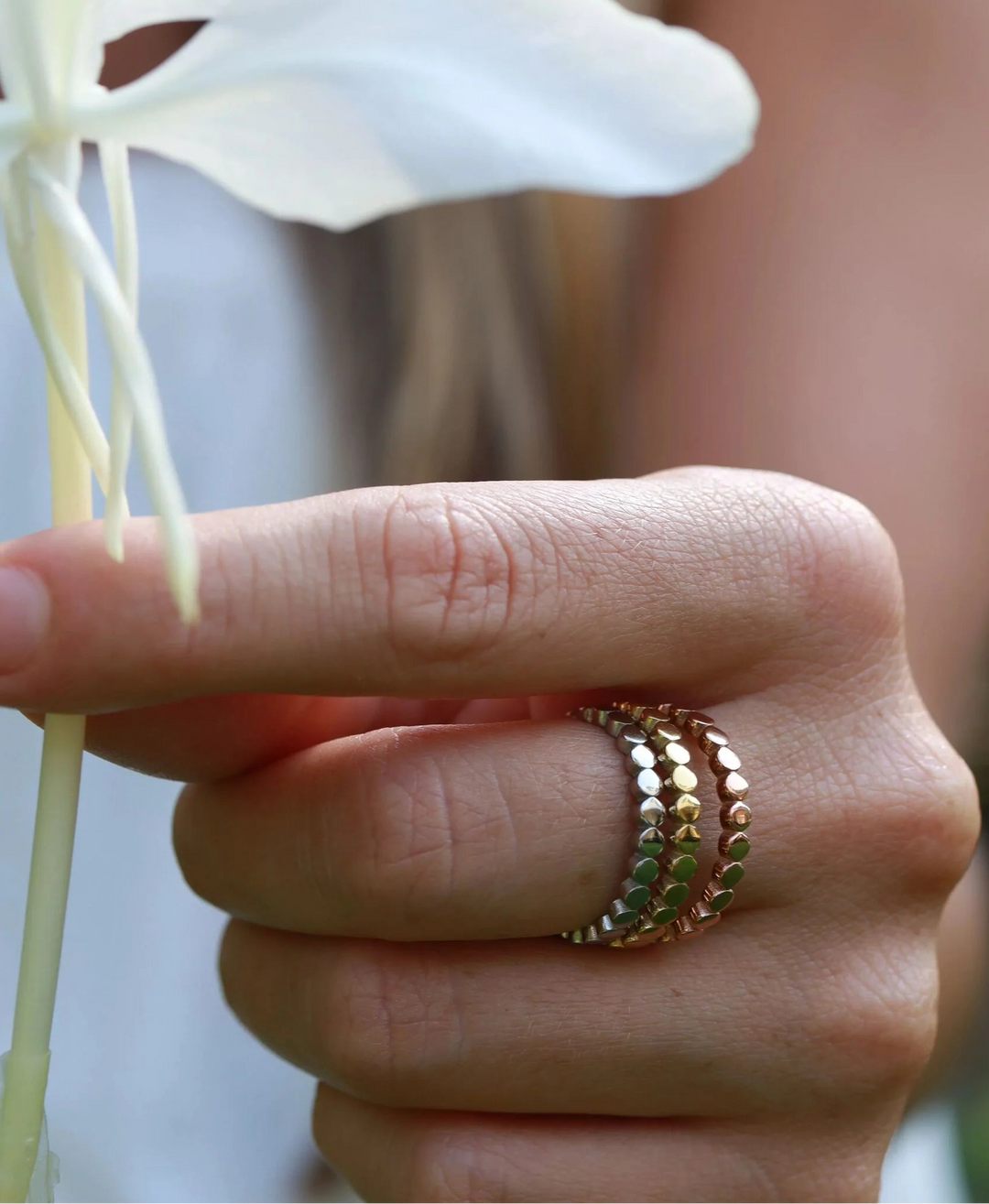 Pebble-textured stacking rings in mixed metal finishes