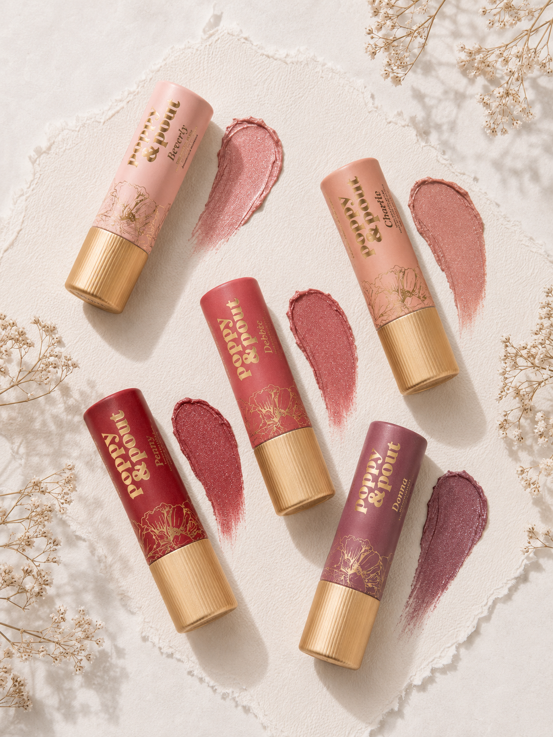 Poppy & Pout lip tint shades in recyclable cardboard tubes, flat lay